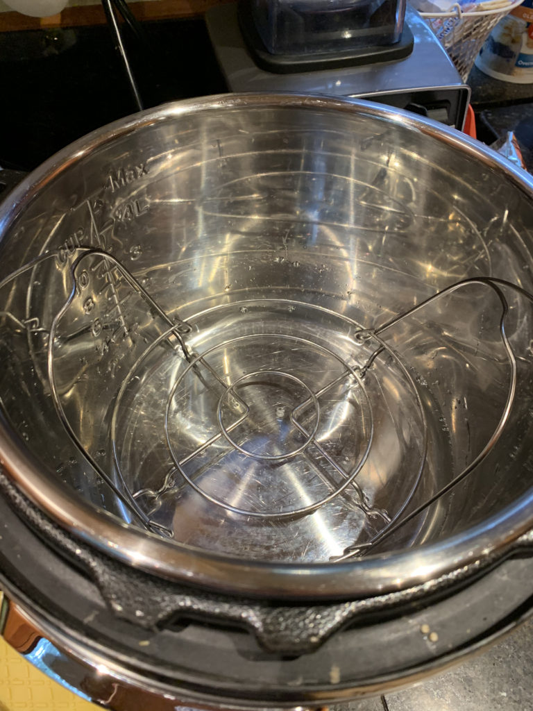 One cup water in the Instant Pot with the wire trivet